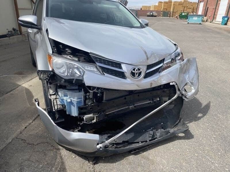 Vehicle with severe front-end collision damage before repair