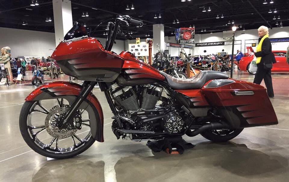 Candy-red custom motorcycle at a show